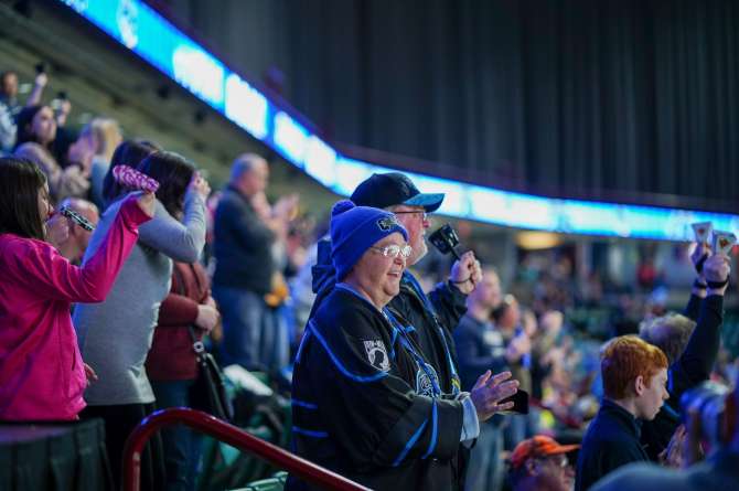 Fans cheering on the game
