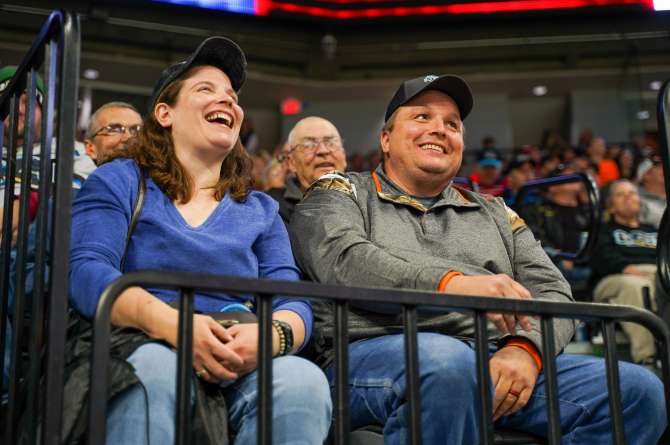 A couple of fans watching a hockey game