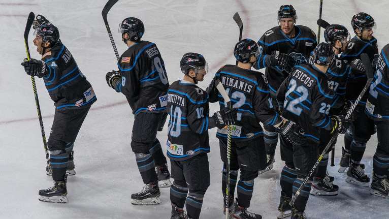 A group of hockey players on the ice