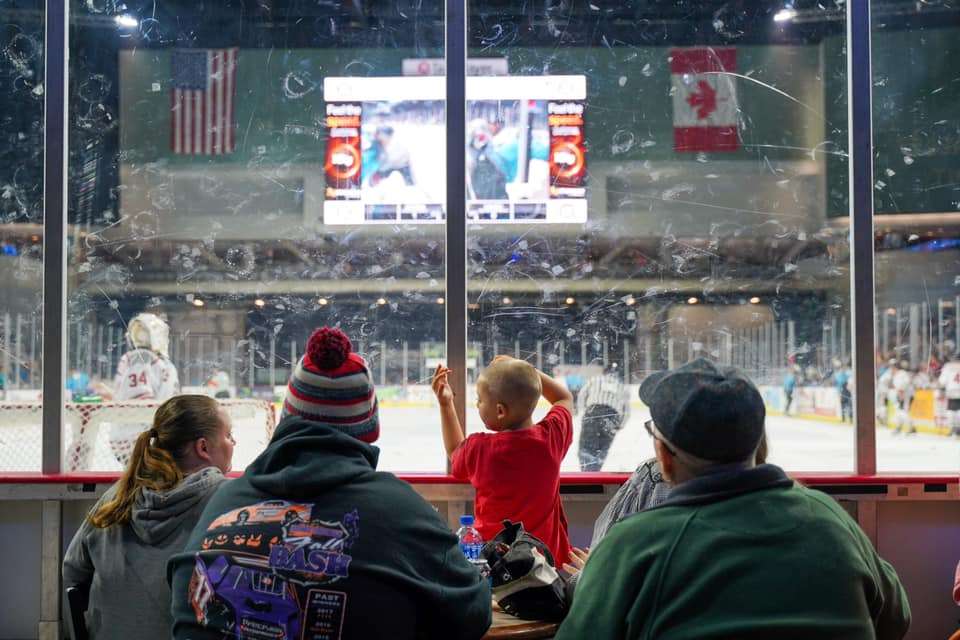 A family of fans watching the game